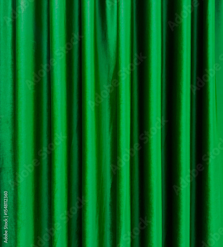 green satin theater drapes or stage curtains, full frame, evoking elegance, drama, and luxury. Perfect for backgrounds, events, and theatrical themes.