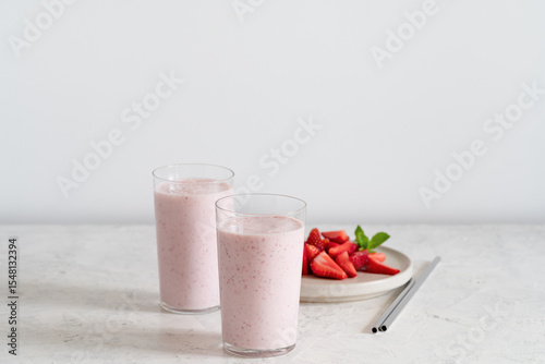 Summer refreshing cold drink, strawberry milkshake in glass