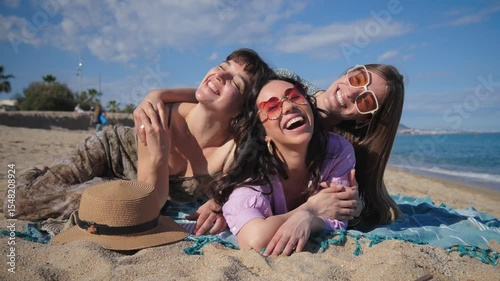 A lively group of three friends enjoying a sunny day at the beach while taking a cheerful selfie together, surrounded by sand and water, creating unforgettable summer memories full of laughter and joy