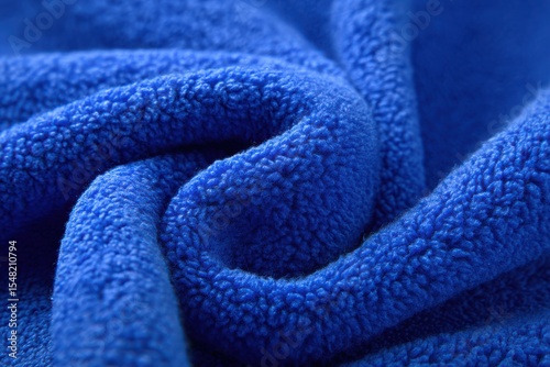 Beautiful close-up view of vibrant blue fleece fabric showcasing intricate texture and softness for creative projects and designs