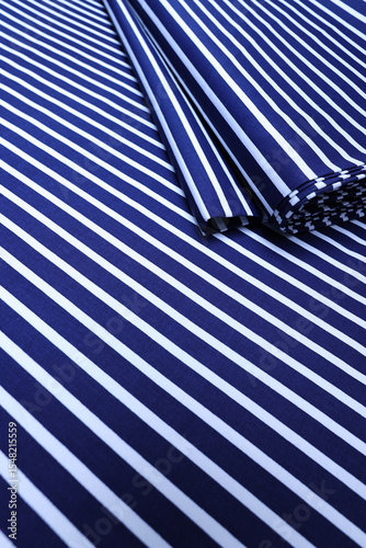 Navy blue cotton fabric with crisp white lines in a minimalist pattern—perfect textile background for tailoring, fashion, or graphic design themes. High-res texture for craft concepts.