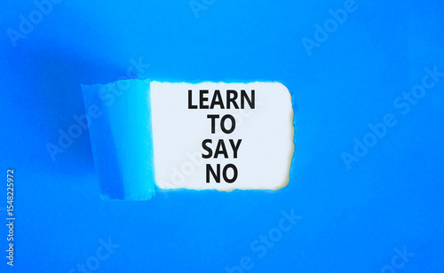 Learn to say no symbol. Concept words phrase Learn to say no on beautiful white paper. Beautiful blue paper background. Business psychological Learn to say no concept. Copy space.