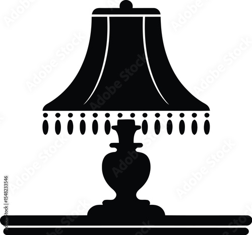 A black silhouette of a table lamp with a fringed shade on a white background in a simple design style