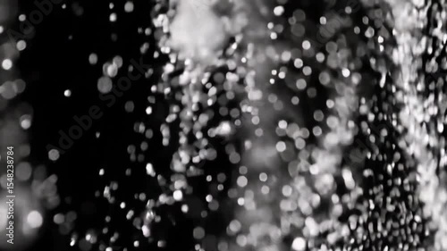 Abstract Black and White Water Drops – Slow Motion Artistic Splash Effect falling water drops, ideal for backgrounds, transitions, or creative projects