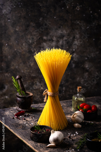 Italian food background with spaghetti, tomato and spices