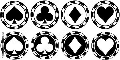 Roulette chips with card suit logos in black and white and white and black, betting or gambling element