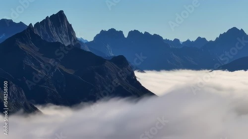 Stunning Mountain Peaks Emerging from a Sea of Clouds - Nature's Majesty