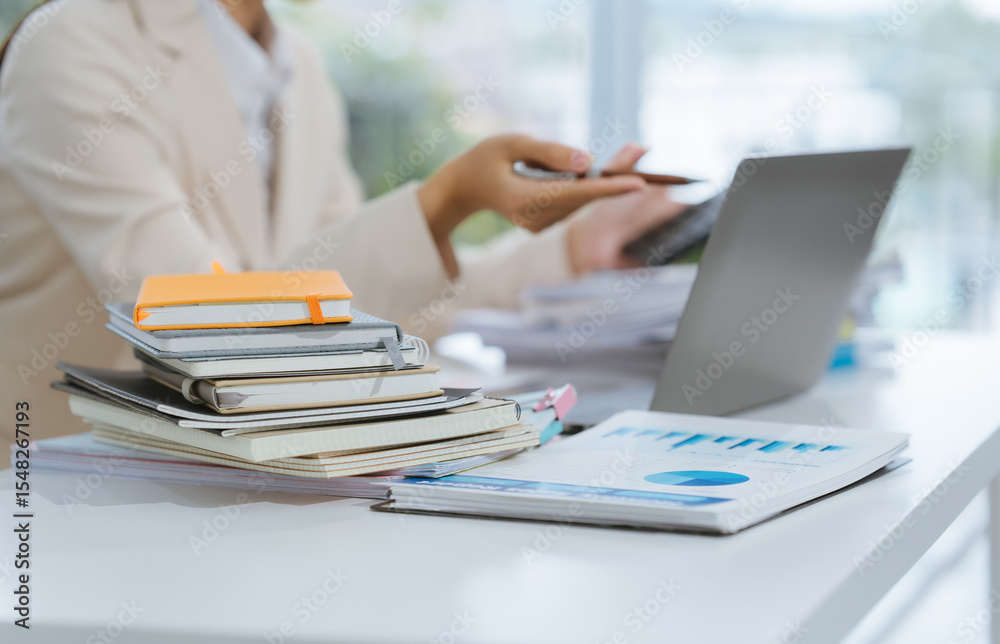 Fototapeta premium Businesswoman Analyzing Financial Data at Desk