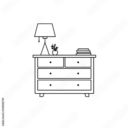 Simple dresser with lamp and books.  Elegant dresser with two drawers and lampshade, perfect for bedroom decor.
