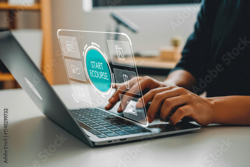 Hands typing on a laptop, interacting with a digital interface displaying 