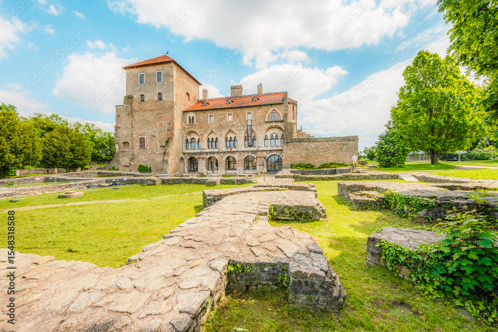 Old stone Tata Castle - 14th-century castle and museum with restored rooms and garden in Tata town, Hungary Old stone Tata Castle - 14th-century castle and museum with restored rooms and garden in Tata town, Hungary