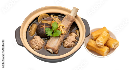 A Claypot of Herbal Malaysian Bak Kut Teh a Savory Pork Rib Soup with Dough Sticks on isolated transparent background