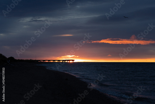 sunrise at the pier strait of Magellan southern dawn from the sea