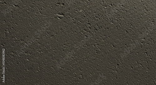 Close up of dark gray asphalt surface with rough texture and small pebbles visible throughout it