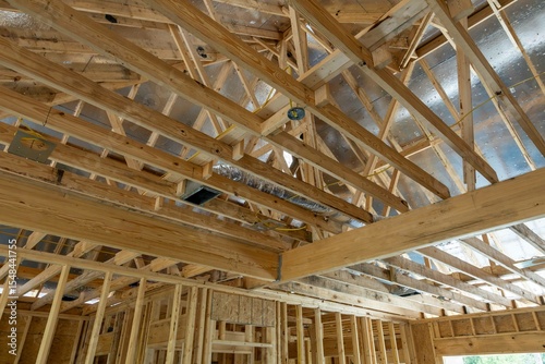 New home construction attic exposed rafters hvac duct work trusses 