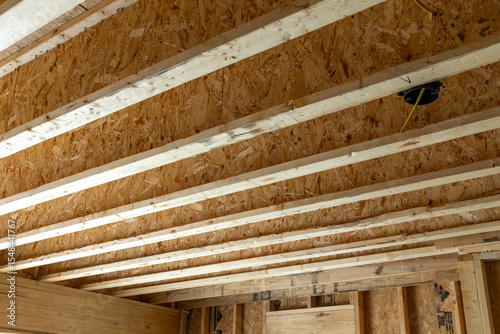 new home construction detail I-Beam subfloor upstairs bonus room floor load bearing beams 