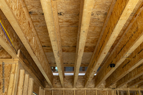 new home construction detail I-Beam subfloor upstairs bonus room floor load bearing beams 