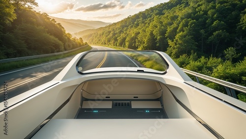 Futuristic vehicle cruising down a scenic road, bathed in the golden light of sunset.