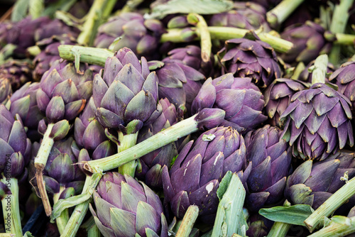 purple artichokes are ready to be sold at the market