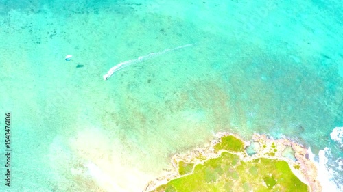 Kitesurfer at Kailua beach, near Popoia island. Oahu, Hawaii.