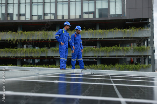 Professional solar engineer installation and inspection the solar panel of solar roof system , verifying system integrity, green renewable energy or sustainable energy concept