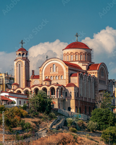 Historic Saint Theodoroi Church in Thessaloniki, Greece, showcasing traditional Byzantine architecture with its distinctive red brickwork, arched windows, and serene atmosphere. 