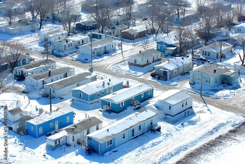 Aerial view of a snowy mobile home park