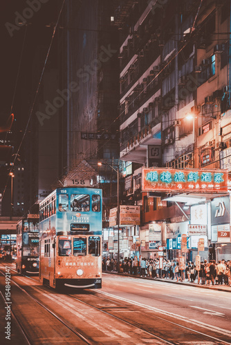 Tram and Bustling Night Scene in Hong Kong