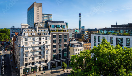 Photos Aerial view of Hanover Square in London featuring green park space, surrounding classic architecture, and city streets on a clear day
