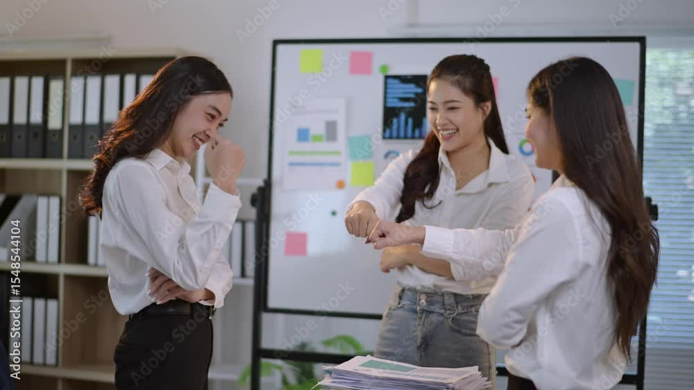 Happy businesswomen celebrating success in office Happy businesswomen celebrating success in office