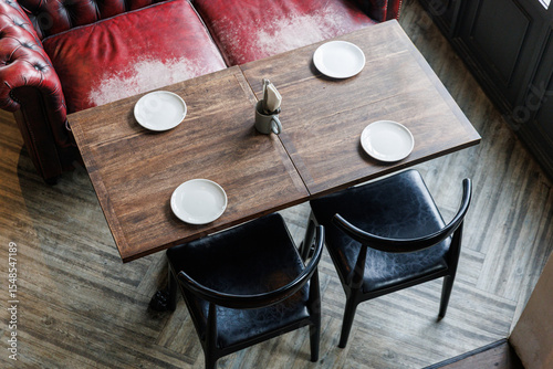 Stylish Cafe Interior: Cozy Seating and Modern Wooden Tables