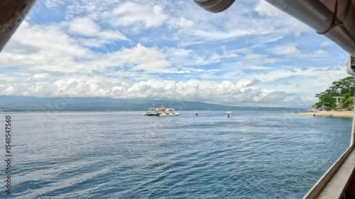 Looking at ocean and coast from ferry in Philippines