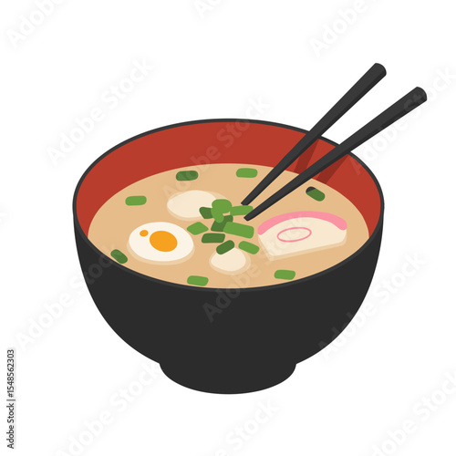 Miso soup in a black bowl with green onions and chopsticks  