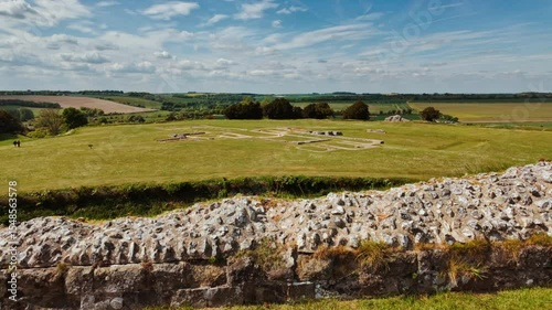 Concentric earthwork banks and weathered masonry remnants capturing the ancient fortifications, Old Sarum, Salisbury, Wiltshire, England, UK