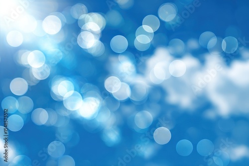Abstract blue bokeh background with white light circles and soft highlights.