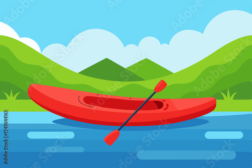 Red canoe rests on green grass near a tranquil lake, awaiting summer travel