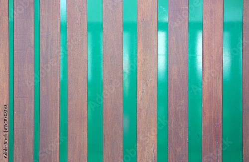 Wooden panels against a green background close-up abstract texture