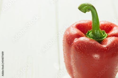 Fresh red pepper on wooden table