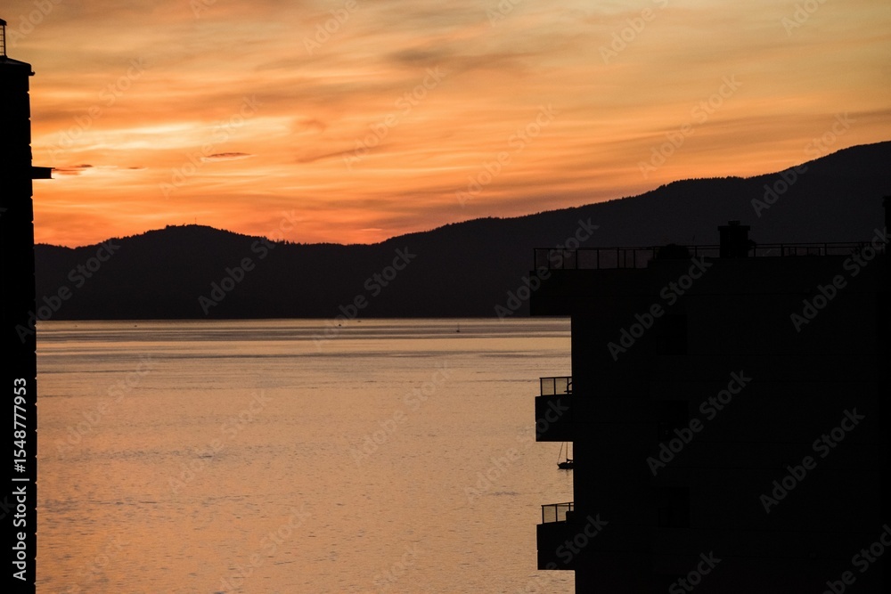 Fototapeta premium Scenic view of lake mountain during sunset