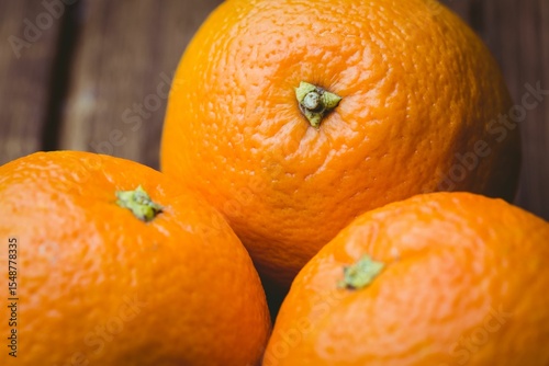 Close-up of oranges on wooden table