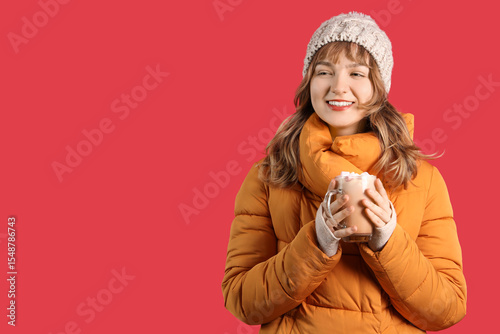 Pretty young woman holding ...