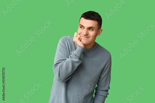 Thoughtful young man ponder...