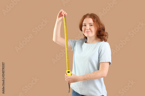 Young woman with measuring ...