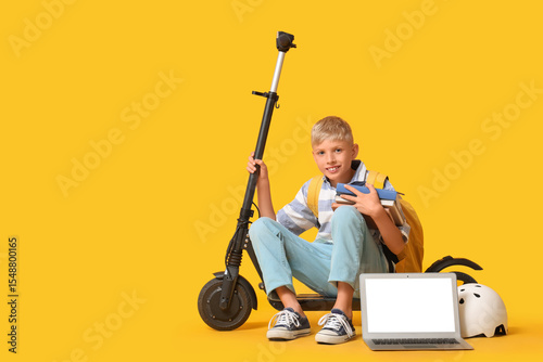 Cute schoolboy with books, ...