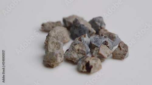 Kidney stone fragments broken up by ultrasonic waves on a rotating table
