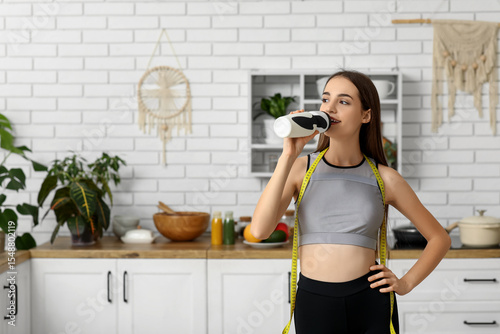 Sporty young woman with tap...
