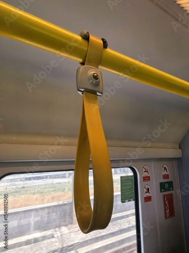 Yellow Grab Handle on Public Transport Train Interior