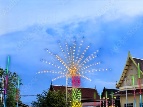 Illuminated Starburst Lights at Thai Temple Festival Dusk