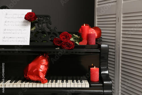 Piano with note sheet, rose...