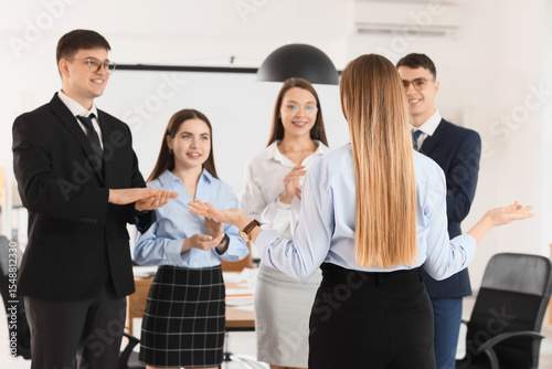 Business people clapping wo...
